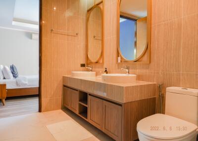 Modern bathroom with double sink and large mirrors