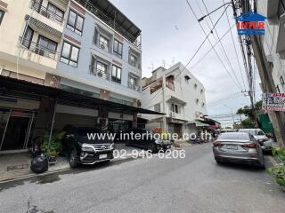 Street view of buildings and parked cars