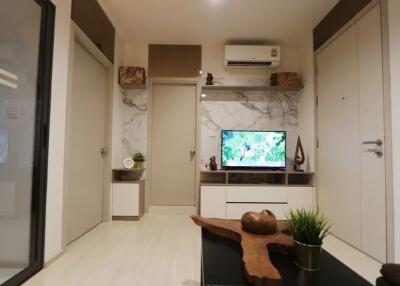 Modern living room with wall-mounted TV and air conditioning