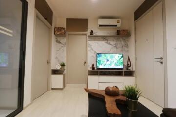 Modern living room with wall-mounted TV and air conditioning