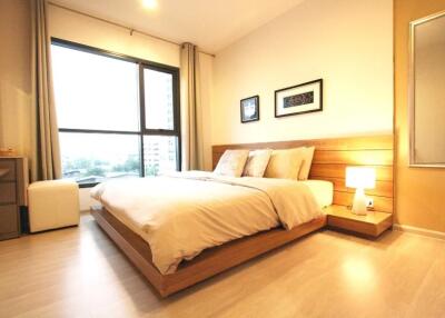Spacious and well-lit bedroom with double bed and modern decor