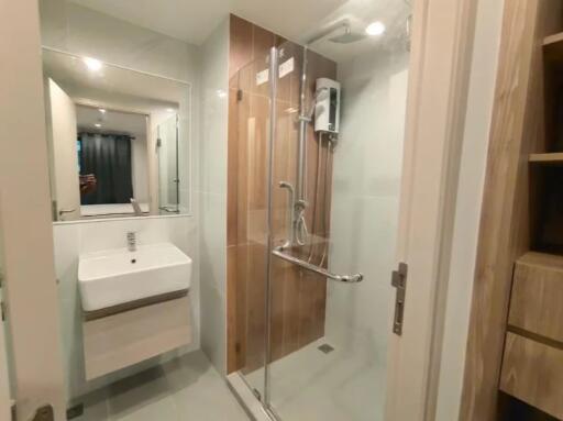 Modern bathroom with glass shower and white sink