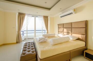 Spacious bedroom with balcony access and modern furniture