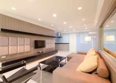 Modern living room with contemporary furniture and recessed lighting