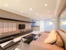 Modern living room with contemporary furniture and recessed lighting