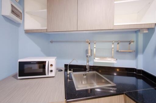 Modern Compact Kitchen with Sink and Microwave