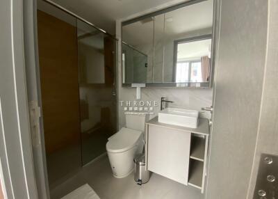 Modern bathroom with glass shower and vanity sink