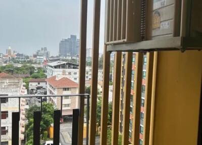 View from the balcony showing surrounding buildings and cityscape