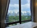 City view through a window with curtains