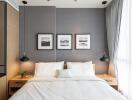 Modern bedroom with gray accent wall and decorative lighting