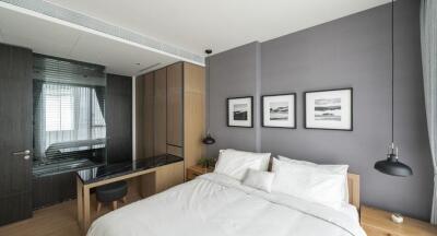 Modern bedroom with bed, wardrobe, and decor