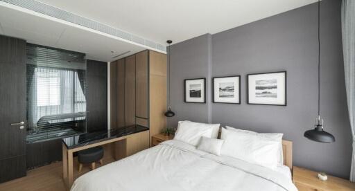 Modern bedroom with bed, wardrobe, and decor