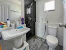 Modern bathroom with white and black marble tiles