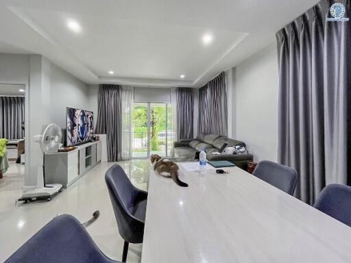 Modern living room with dining area and sliding glass doors