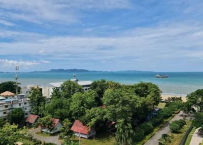 A scenic view of the ocean from a high-rise apartment balcony