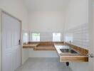 Modern kitchen with tiled walls and wooden countertops