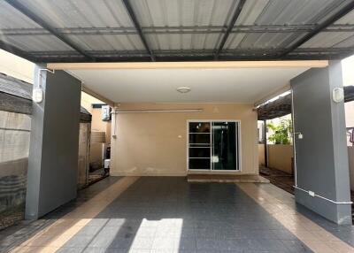 Covered garage with tiled floor