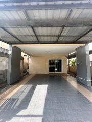 Covered garage with tiled floor