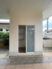 Outdoor area with sliding door and tiled floor