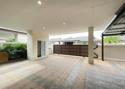 Covered outdoor space with tiled flooring