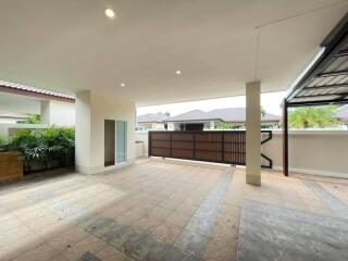 Covered outdoor space with tiled flooring