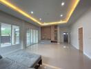 Spacious living room with modern ceiling lights and large windows