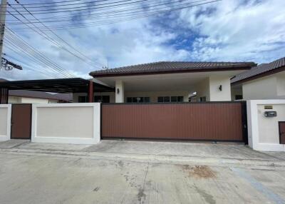 Front view of a one-story house with driveway