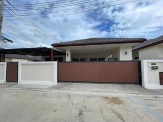 Front view of a one-story house with driveway