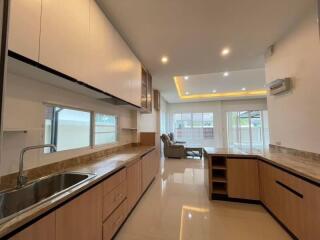 Modern kitchen with ample storage and lighting