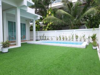 Modern house with a private pool and lawn