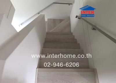 Wooden staircase with metal railings