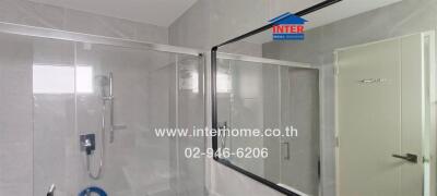 Modern bathroom with large mirror and shower area