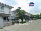 Street view of modern residential houses with gated fences