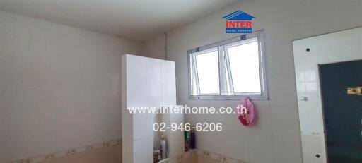 Bathroom with window and storage unit