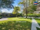 Outdoor garden area of a residential building with pathways and trees