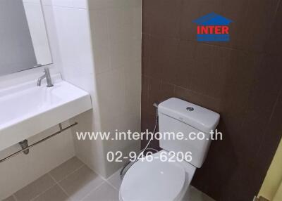 Modern bathroom with white sink and toilet