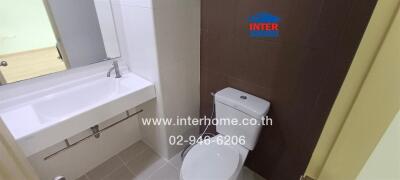 Modern bathroom with white sink and toilet
