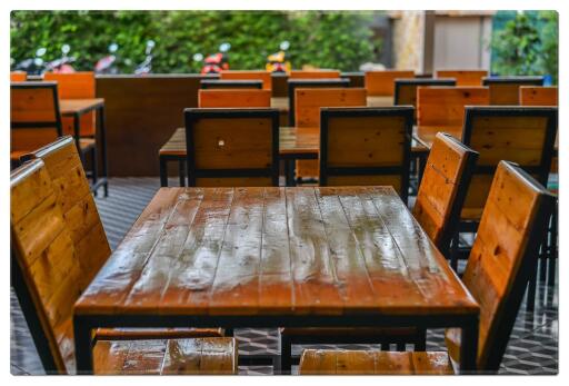 Dining area with wooden tables and chairs