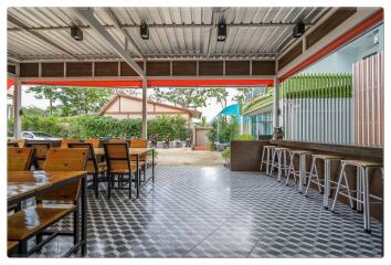 Covered outdoor seating area with tiled floor
