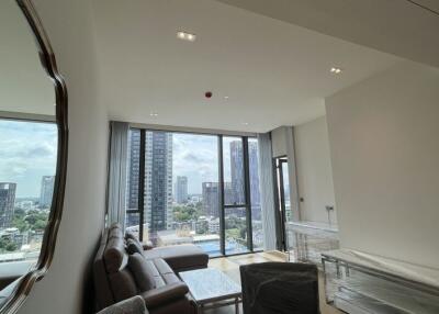 Modern living room with large windows and city view