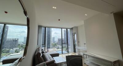 Modern living room with large windows and city view