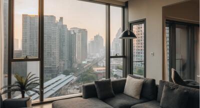 Modern living room with large windows overlooking cityscape