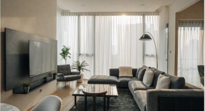 Modern living room with large windows and natural light