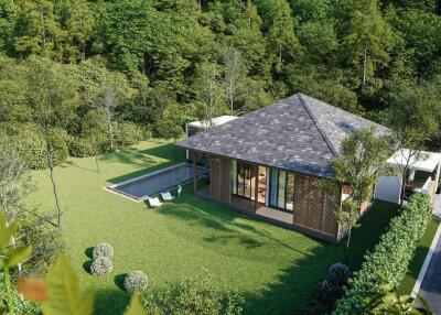 Aerial view of a secluded modern house with surrounding greenery