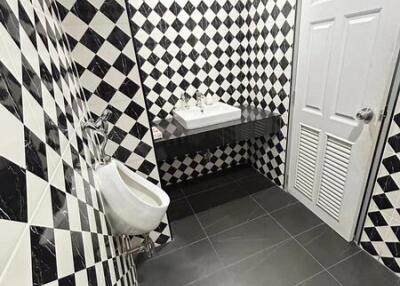 bathroom with checkered wall tiles