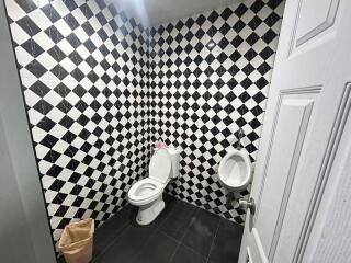 Bathroom with checkered tile walls