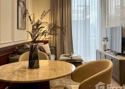 Modern living room with neutral tones, large window with curtains, and a marble dining table.