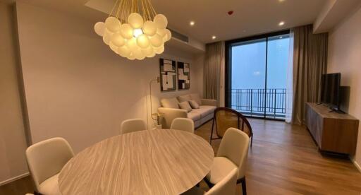 Modern living room with dining area and large windows