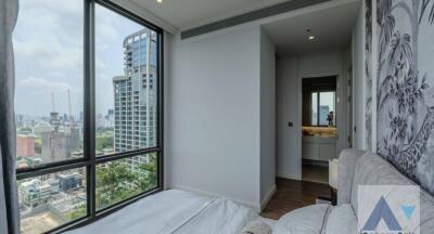 Modern bedroom with a view of the city