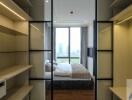 Modern bedroom with walk-in closet and large windows